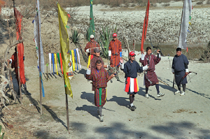 Bhutan men dancing Taste of Bhutan