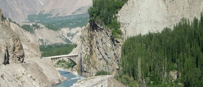 Cycle Pakistan Kyrgzstan China banner canyon bridge